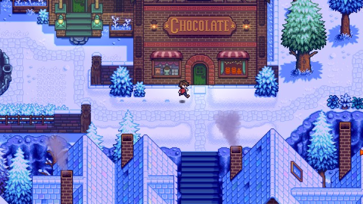 Figur läuft in Haunted Chocolatier an einer Schokoladenfabrik vorbei.