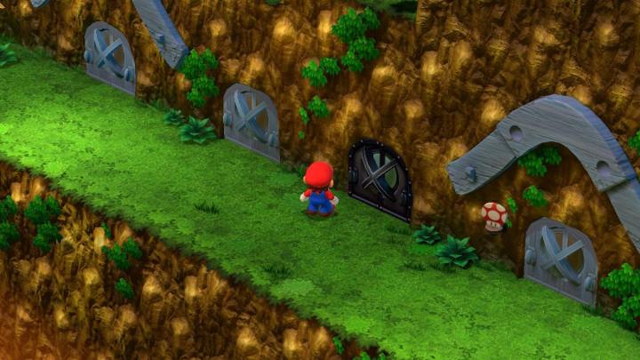 Mario steht in Super Mario RPG in der Nähe einer Tür.