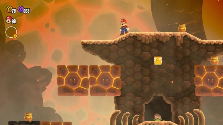Mario steht in Super Mario Bros. Wonder in der Nähe einiger erhitzter Blöcke.