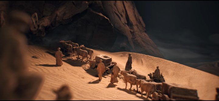 Figuren, die in Civilization 7 durch die Wüste laufen.