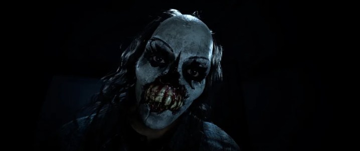 In Until Dawn starrt ein Bösewicht mit einer Clownsmaske bedrohlich.