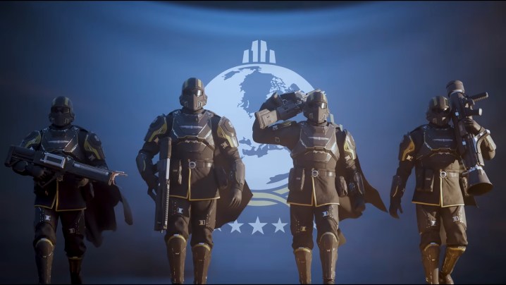 Im Trailer zu Helldivers 2 laufen vier Soldaten vor einer blauen Super-Earth-Flagge.